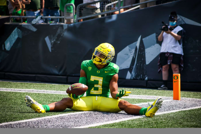 Johnson celebrates a touchdown against Fresno State in week 1 at Autzen Stadium.